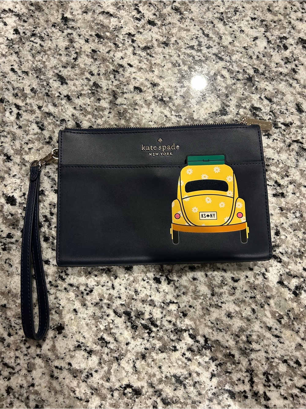 kate spade navy clutch with yellow car graphic